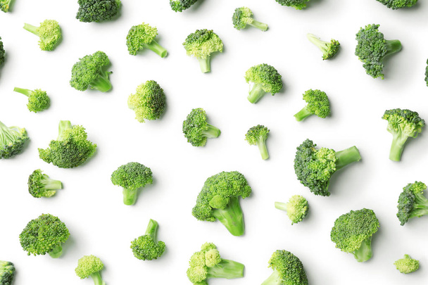 Flat lay composition with fresh green broccoli on light background - Foto, Imagem