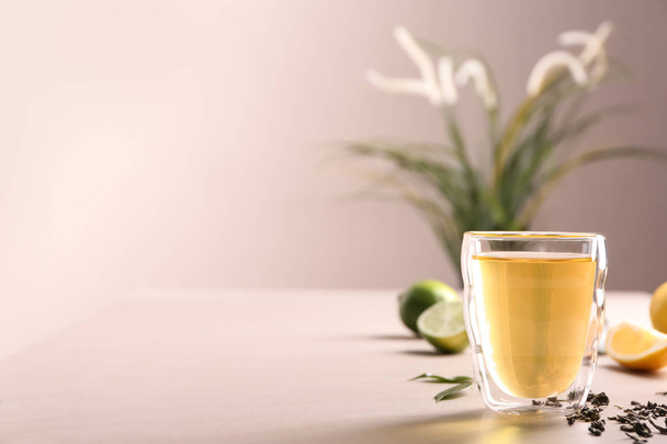 Glass with delicious green tea on table - Zdjęcie, obraz
