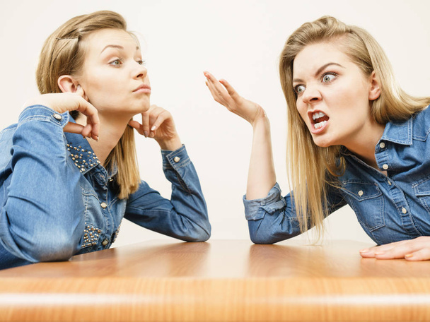 Two women having argue mocking up being mad at each other. Female telling off, ignorance concept. - Foto, afbeelding