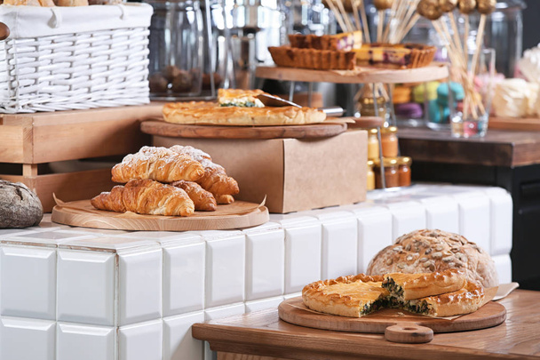 Assortment of delicious pastries in bakery - Photo, Image