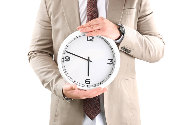 Man holding clock on white background. Time management concept - Foto, Imagem