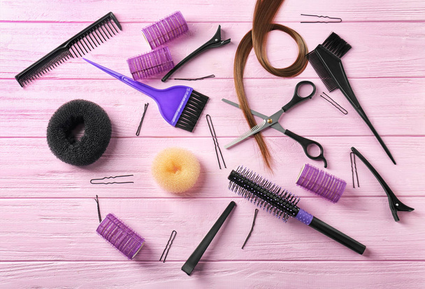 Set of hairdresser's supplies on color wooden background - Zdjęcie, obraz