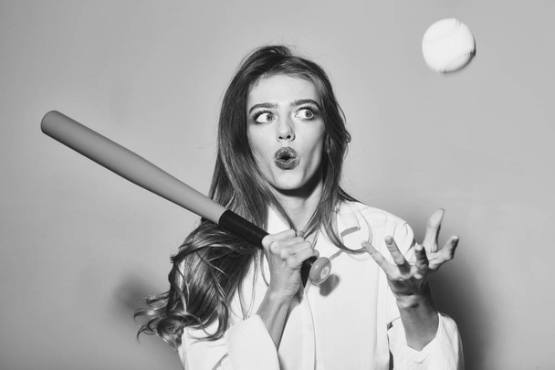 Face girl for magazine cover. Girl face portrait in your advertisnent. pretty sexy woman with long hair holds green baseball bat - Foto, afbeelding