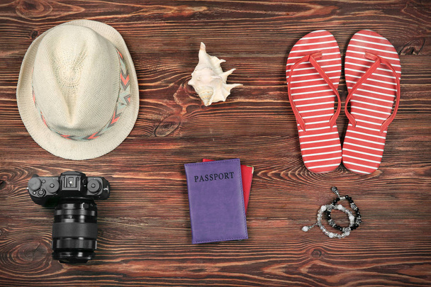 Composition with tourist's stuff on wooden background, top view - Photo, Image