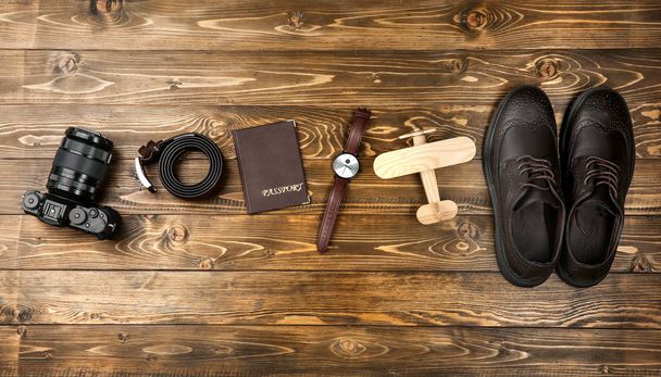 Composition with tourist's stuff on wooden background, top view - Foto, Imagem