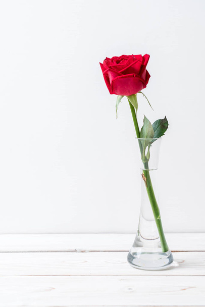 red rose on wood background - 写真・画像