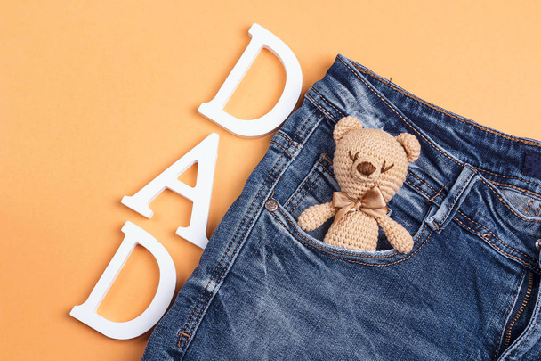 Father's Day background with toy bears in a jeans pocket. Father's  Day concept.  - Foto, afbeelding