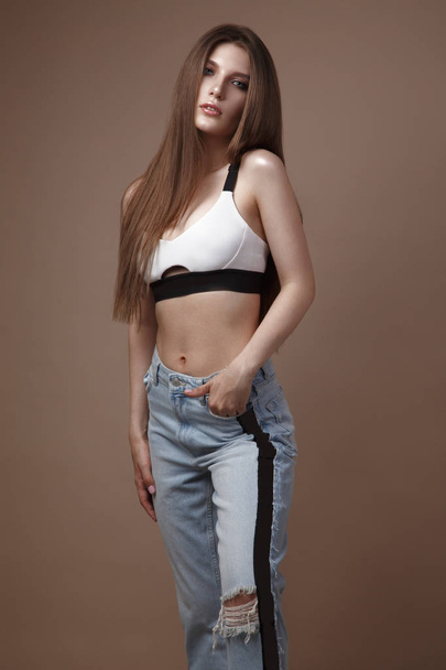 sexy fashion model with long hair, beautiful eyes, full lips, perfect skin is posing in studio for glamour test photo shoot showing different poses - Φωτογραφία, εικόνα