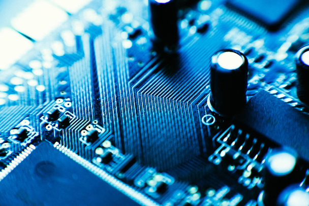 computer board capacitors blue color close up. - Фото, зображення
