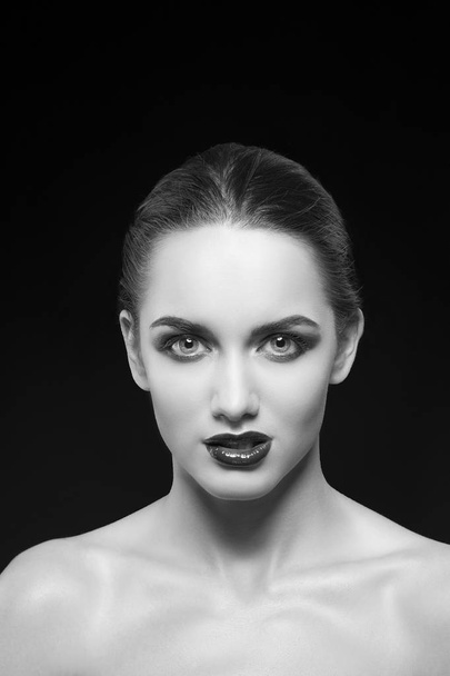 young woman with dark lips posing on black background - Foto, Imagem