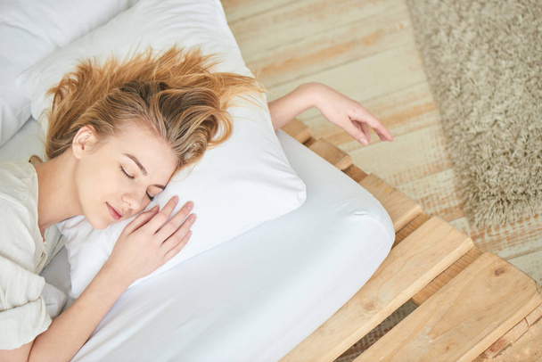 attractive woman peacefully sleeping in bed, close-up  - Φωτογραφία, εικόνα
