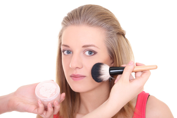 attractive woman with make-up brush over white - Фото, изображение