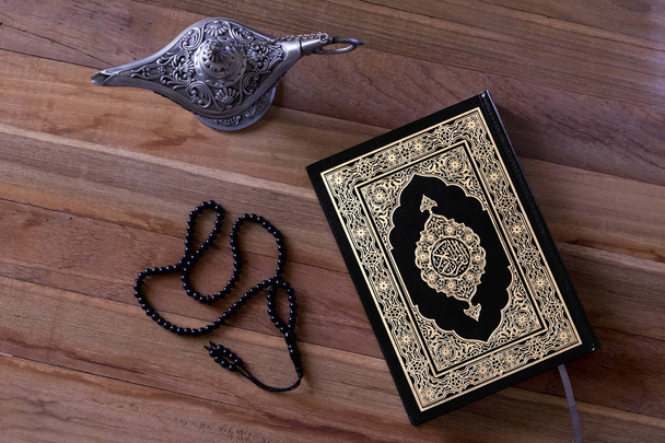 Holy quran with rosary and a wooden letters inside - Fotó, kép
