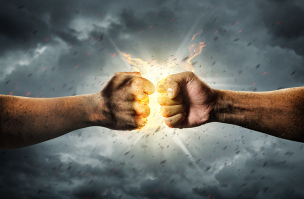 Close up clash of two fists. Conflict Concept  - Photo, Image