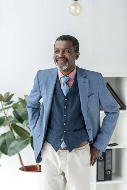 stylish african american businessman in modern office - Zdjęcie, obraz
