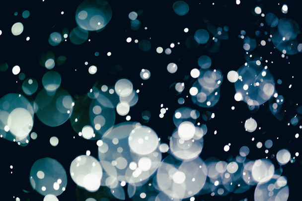 Christmas bokeh background texture abstract light glittering stars on bokeh. glitter vintage lights background - Photo, image