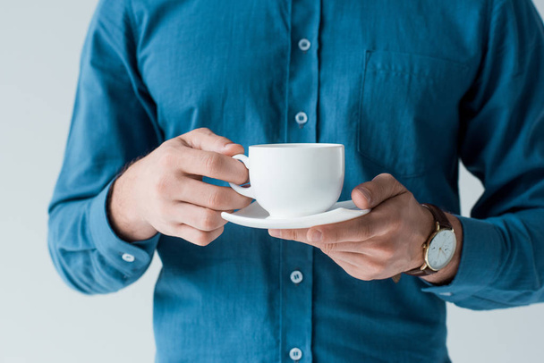 cropped shot of man with cup of coffee isolated on white - Valokuva, kuva