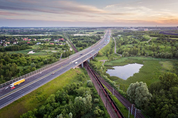 Aerial view on cargo train and motorway. Transport and logistic concept. Zabrze, Silesia, Poland - Photo, Image