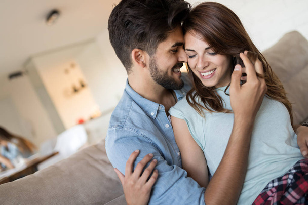 Young attractive couple spending time together at home - Foto, Imagem