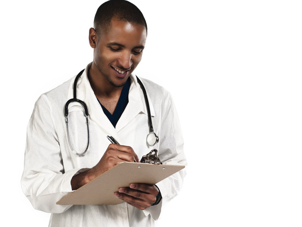 doctors hand holding a clipboard - Фото, зображення