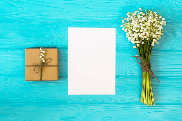 Mockup with bouquet and empty greeting card, gift box top view, copy space for text, flat layMother's day. Women's day. Valentine's day, Birthday background. - Photo, Image