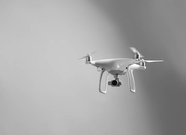 Modern quadcopter on grey background - Фото, зображення