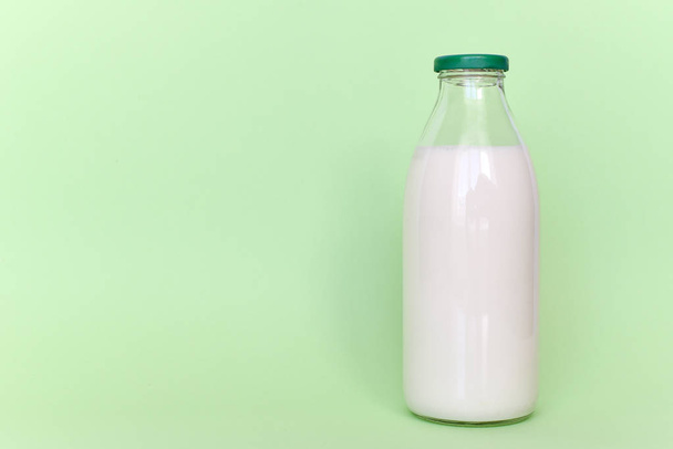 Milk in a glass bottle - Φωτογραφία, εικόνα