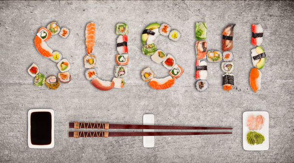 Traditional japanese sushi pieces making inscription. - Foto, immagini