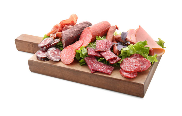 Assortment of delicious deli meats on wooden board, isolated on white - Photo, Image