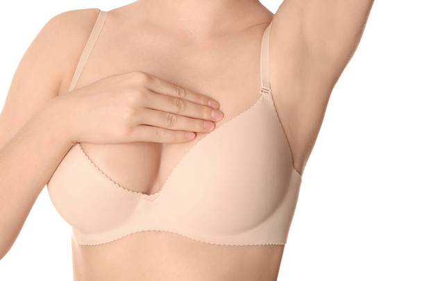 Woman examining her breast on white background, closeup. Cancer awareness concept - Photo, Image