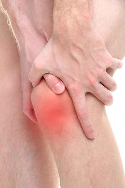 Man holding sore knee, isolated on white - Fotó, kép