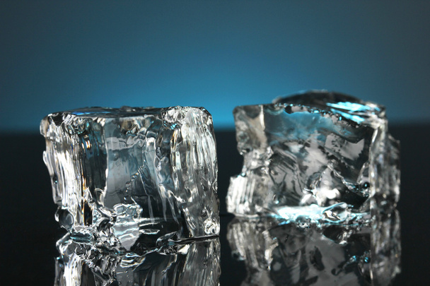 Ice cubes on dark blue background - Fotografie, Obrázek