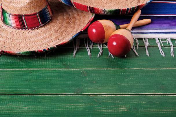 Mexico sombrero fiesta cinco de mayo wood background mexican maracas - Фото, зображення