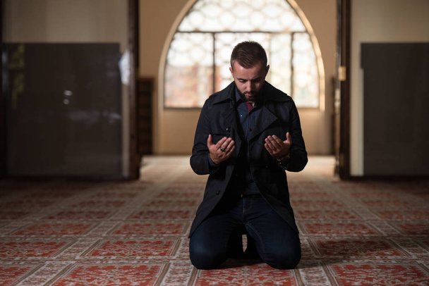 Young Muslim Man Making Traditional Prayer To God Allah - Photo, Image
