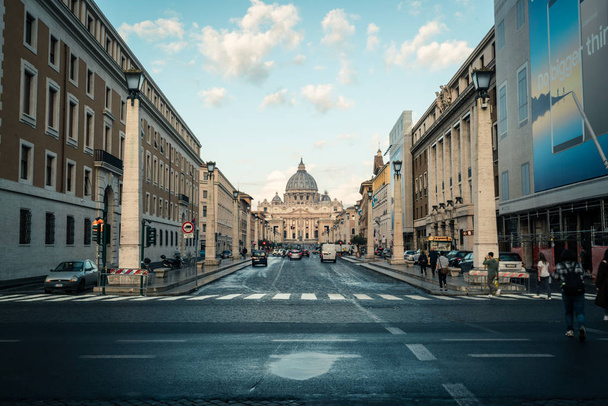 Vatican City, Vatican - Oct 6, 2017: Road traffic on the street in front of St. Peter's Square and St. Peter's Square Basilica. It is the famous travel destination of tourist visiting Rome, Italy. - Фото, изображение
