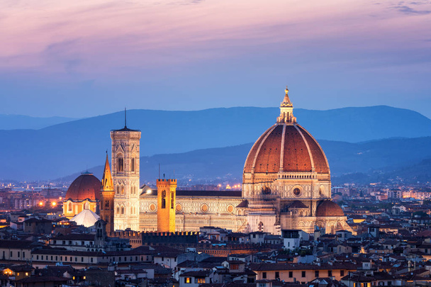 Florence Cathedral (Cattedrale di Santa Maria del Fiore) in historic center of Florence, Italy with night panoramic view of the city. Florence Cathedral is major tourist attraction of Tuscany, Italy. - Photo, Image