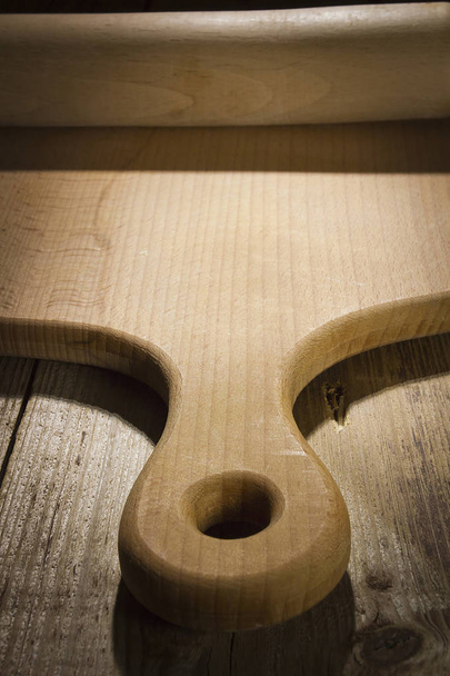 Cutting board and rolling pin on a wooden table - Photo, image