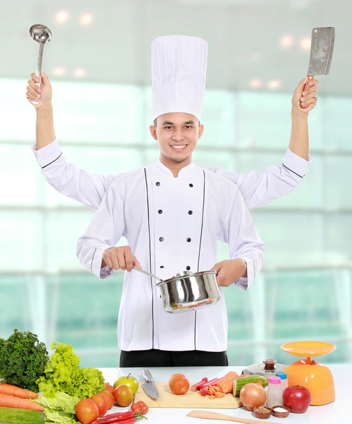 male chef cooking in the kitchen - Foto, Imagem