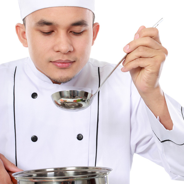 male chef taste his cooking - Foto, Imagem