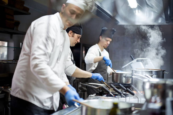 Group of chefs working in the kitchen - Foto, Imagem