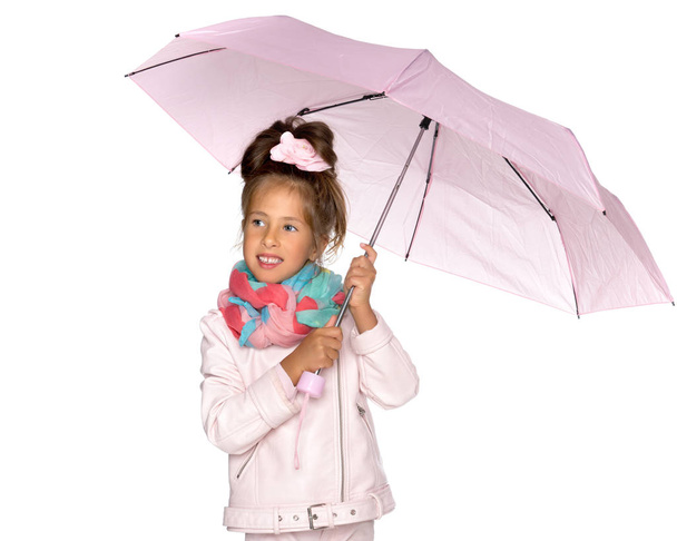 Little girl under an umbrella. - Zdjęcie, obraz