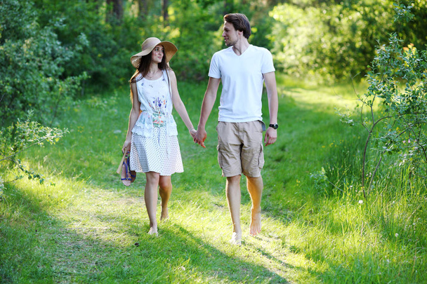 Young couple walking in the woods - Foto, Bild