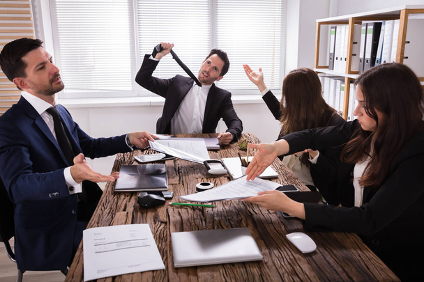 Group Of Frustrated Young Businesspeople Having Discussion In Meeting - Photo, image