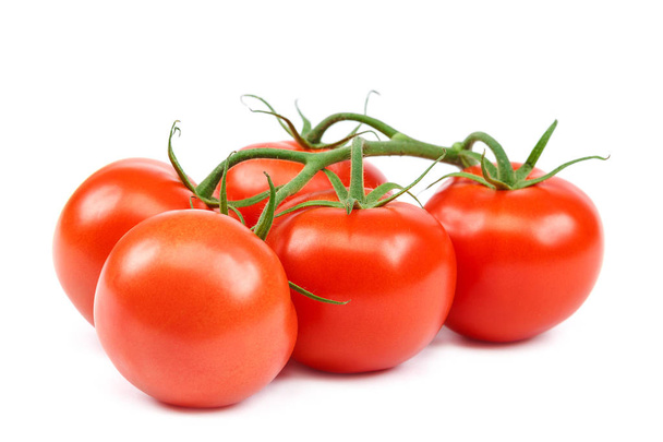 Branch of a fresh red tomato, isolated on a white background. - Valokuva, kuva