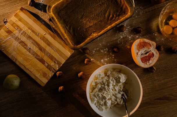 Ingredients for cheese cake on wooden table - Foto, afbeelding