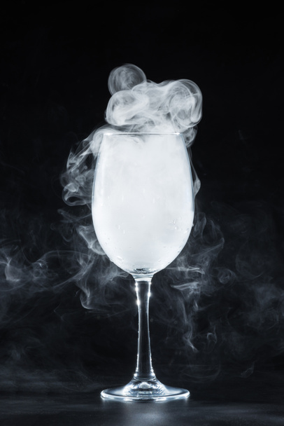 white smoke in wine glass on black background - Foto, Imagem