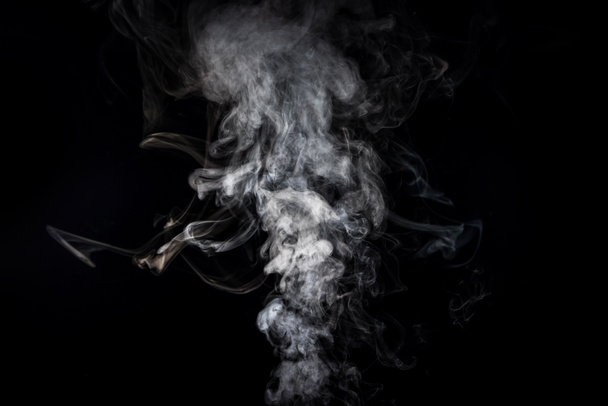 grey smoky swirl from cigarette on black - Photo, Image