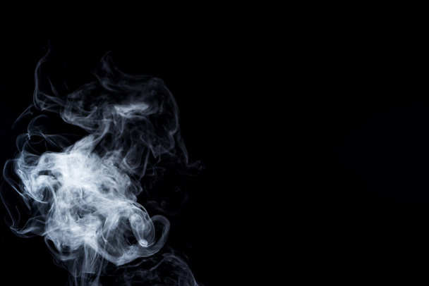 creative background with grey smoky swirl on black with copy space - Фото, зображення