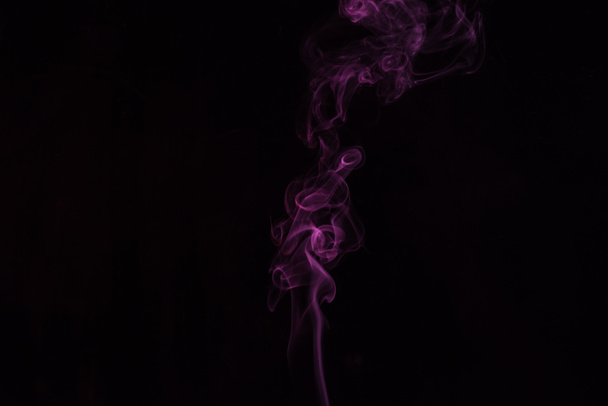 black background with spiritual pink smoky swirl - Foto, Imagem