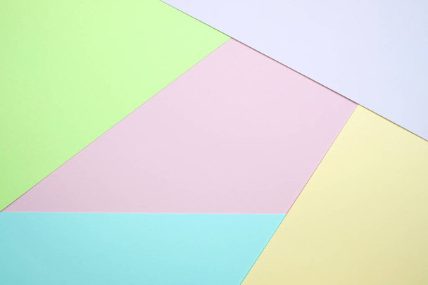 Fashionable  pastel colored paper flat lay top view, geometric background texture, pink, purple, yellow, beige, green and blue colour. - Foto, afbeelding